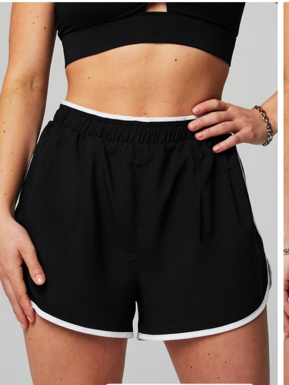 Fabletics Dolphin Short Women’s Black Athletic Shorts with White Trim Large